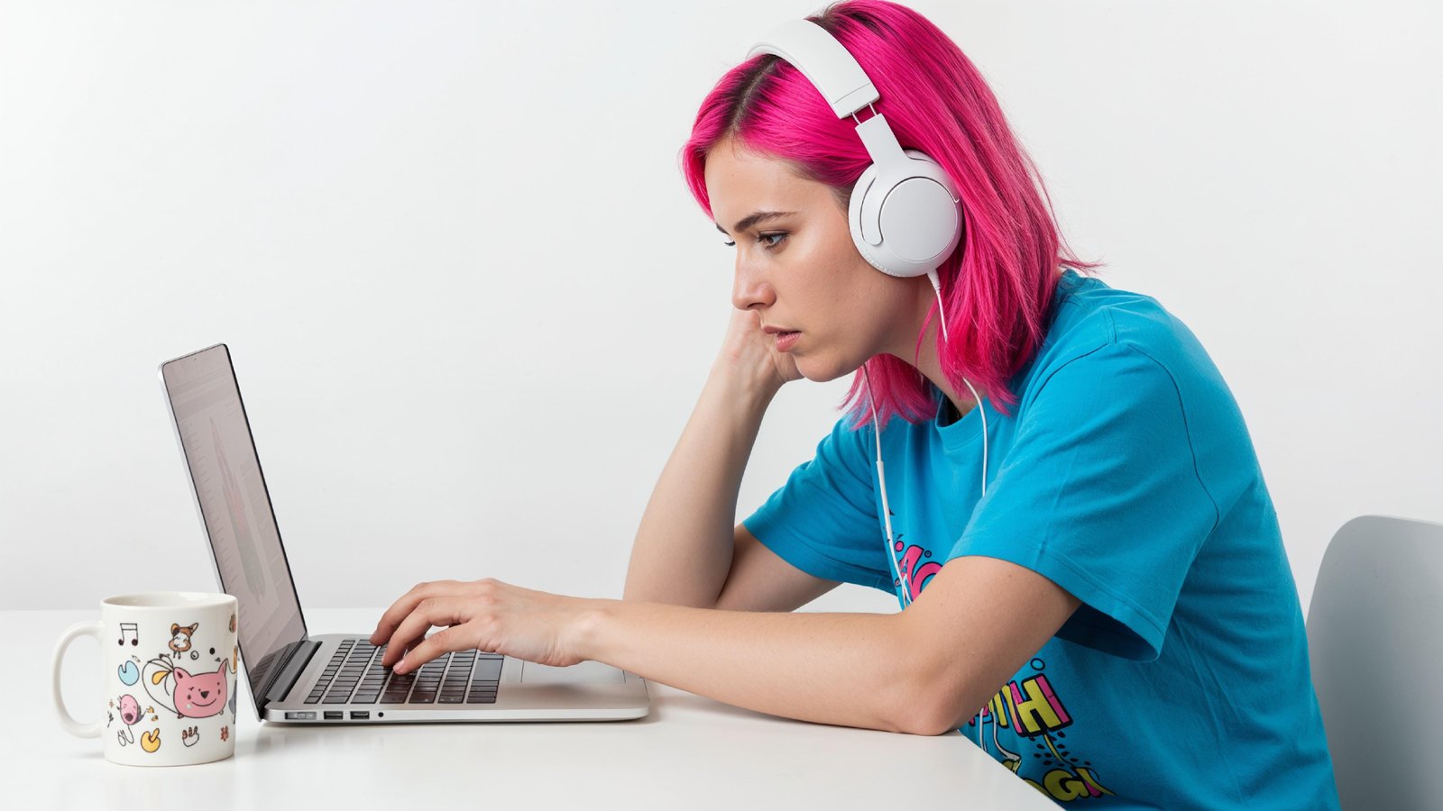 Beautiful Young Woman Working on Laptop at Modern Office Desk, Professional Business Portrait