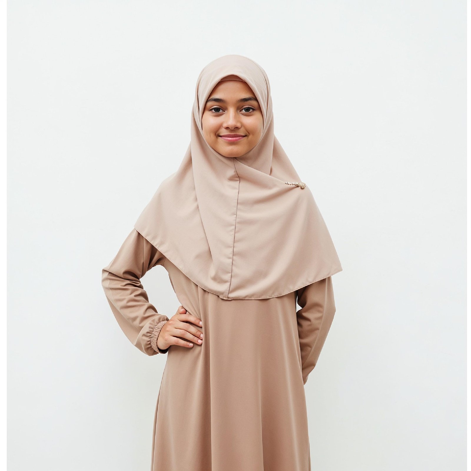 Cute Young Muslim Girl Wearing Beige Hijab and Modest Dress in Studio Portrait