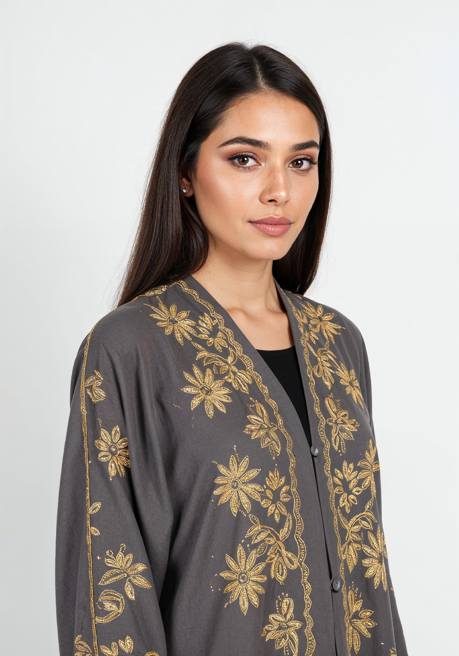 Elegant Muslim Woman Wearing Luxury Black and Gold Embroidered Abaya