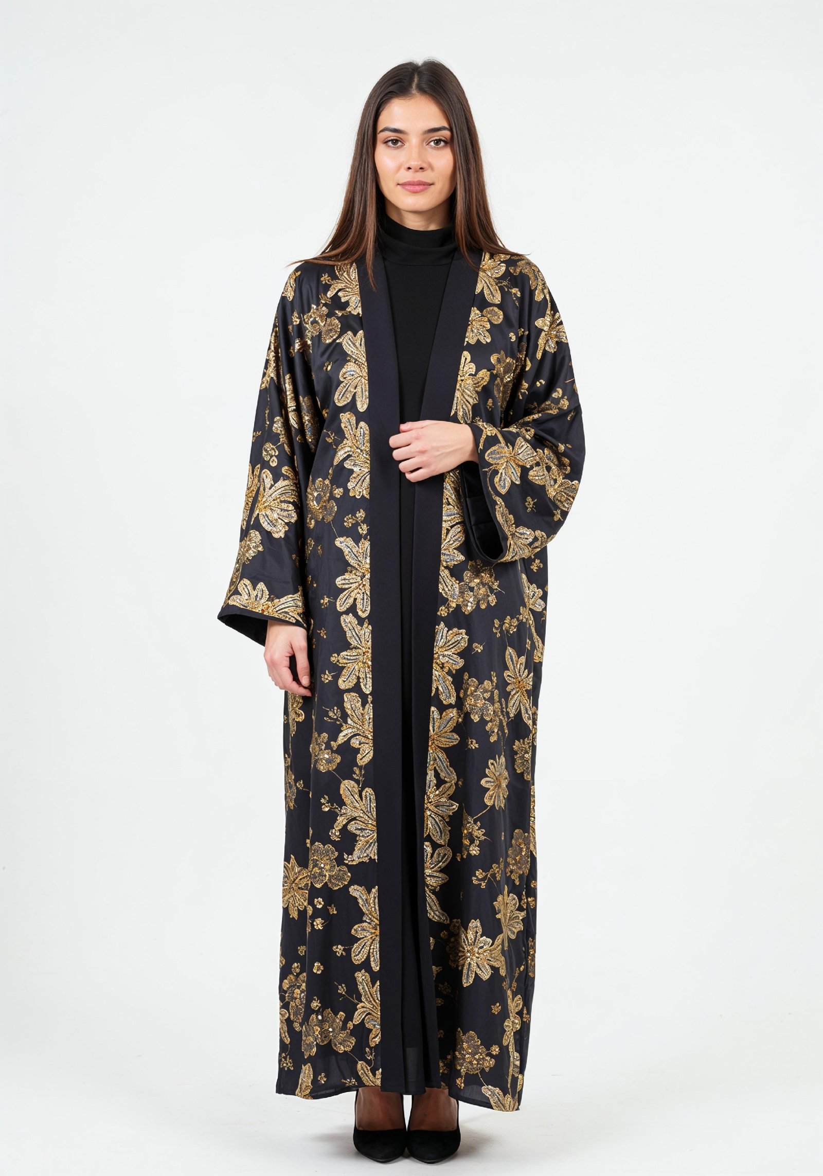 Elegant Muslim Woman Wearing Luxury Black and Gold Embroidered Abaya