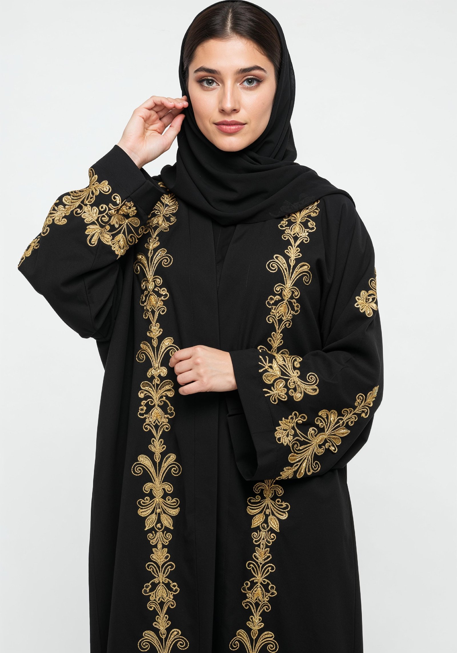 Elegant Muslim Woman Wearing Luxury Black and Gold Embroidered Abaya