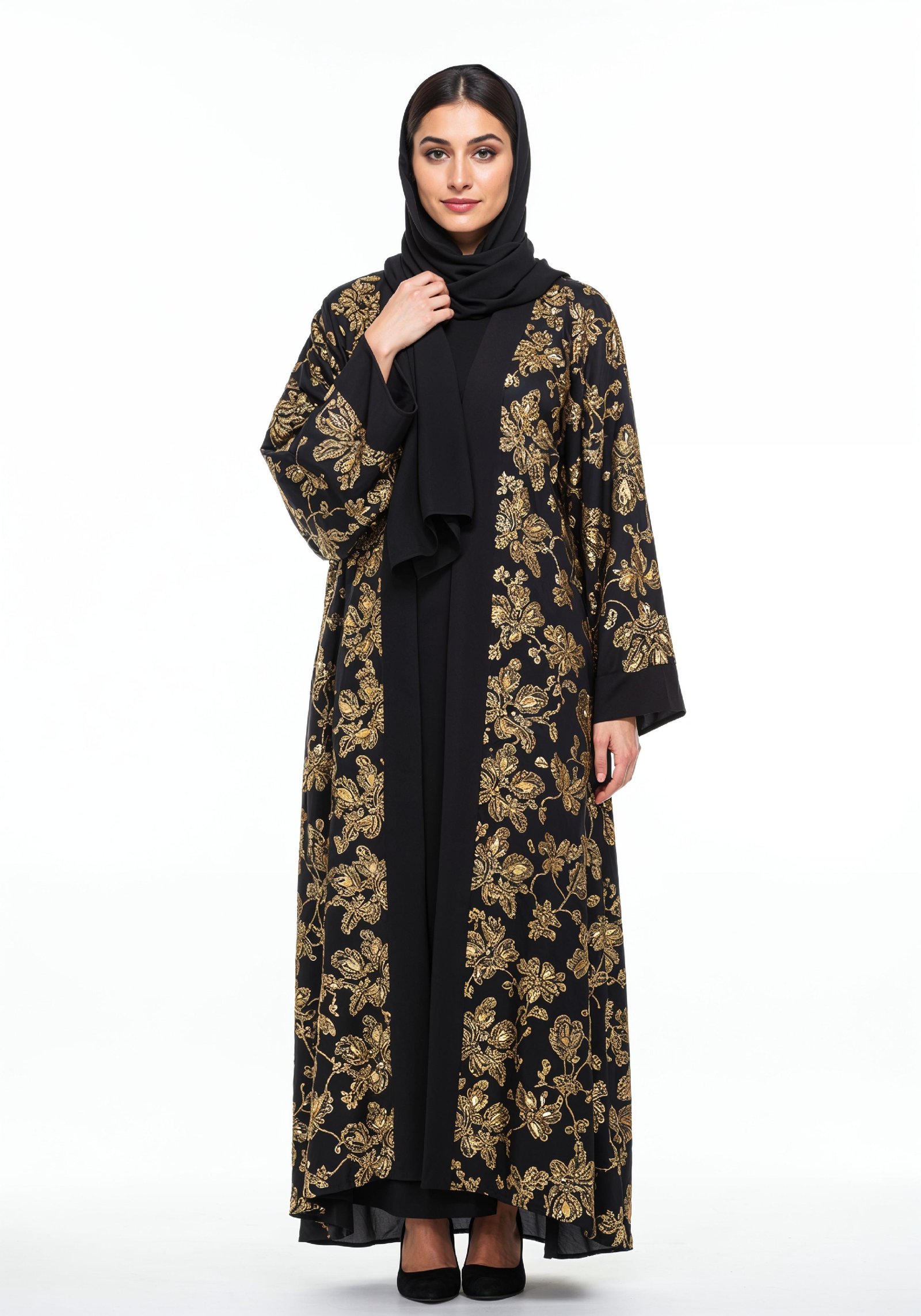Elegant Muslim Woman Wearing Luxury Black and Gold Embroidered Abaya