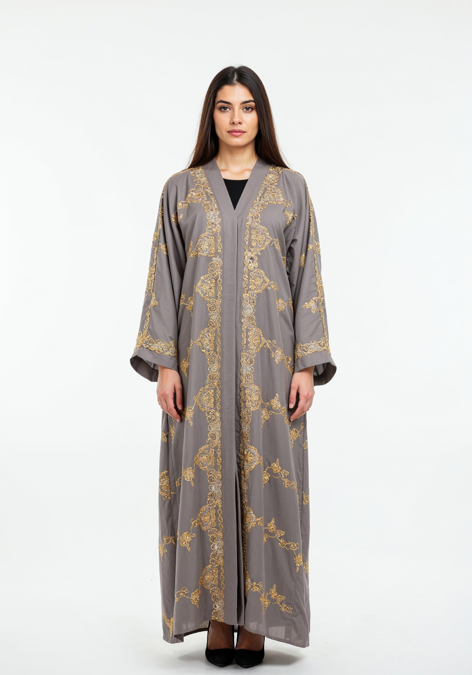 Elegant Muslim Woman Wearing Luxury Black and Gold Embroidered Abaya