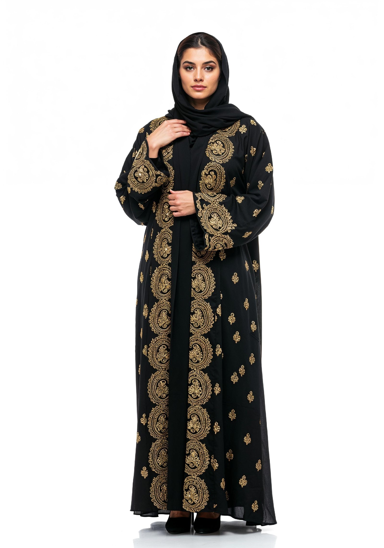 Elegant Muslim Woman Wearing Luxury Black and Gold Embroidered Abaya