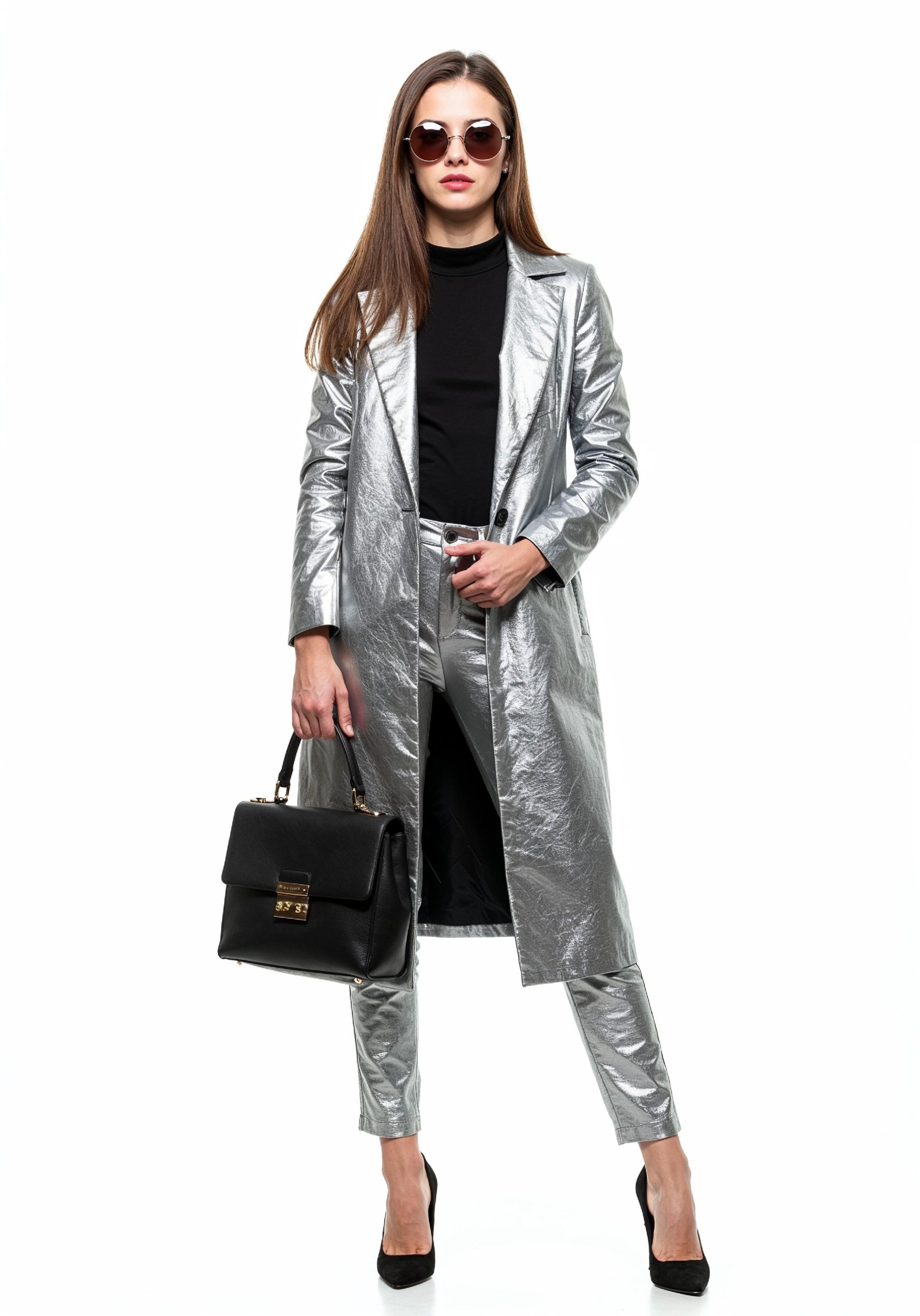 Elegant Young Woman in Coat and Matching Trousers Fashion Portrait