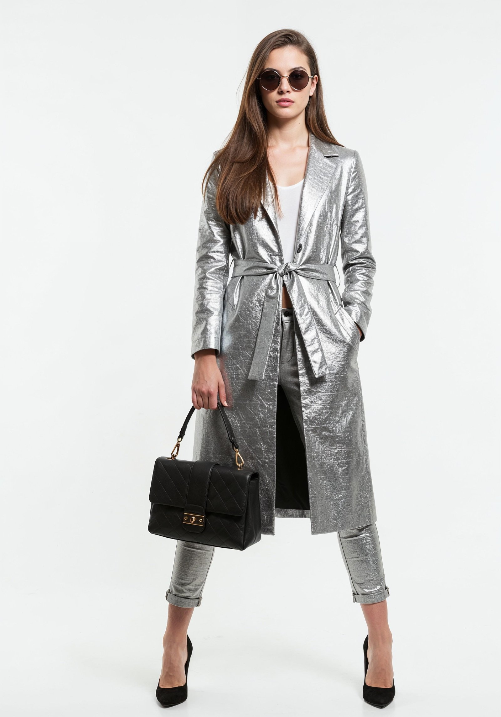 Elegant Young Woman in Coat and Matching Trousers Fashion Portrait