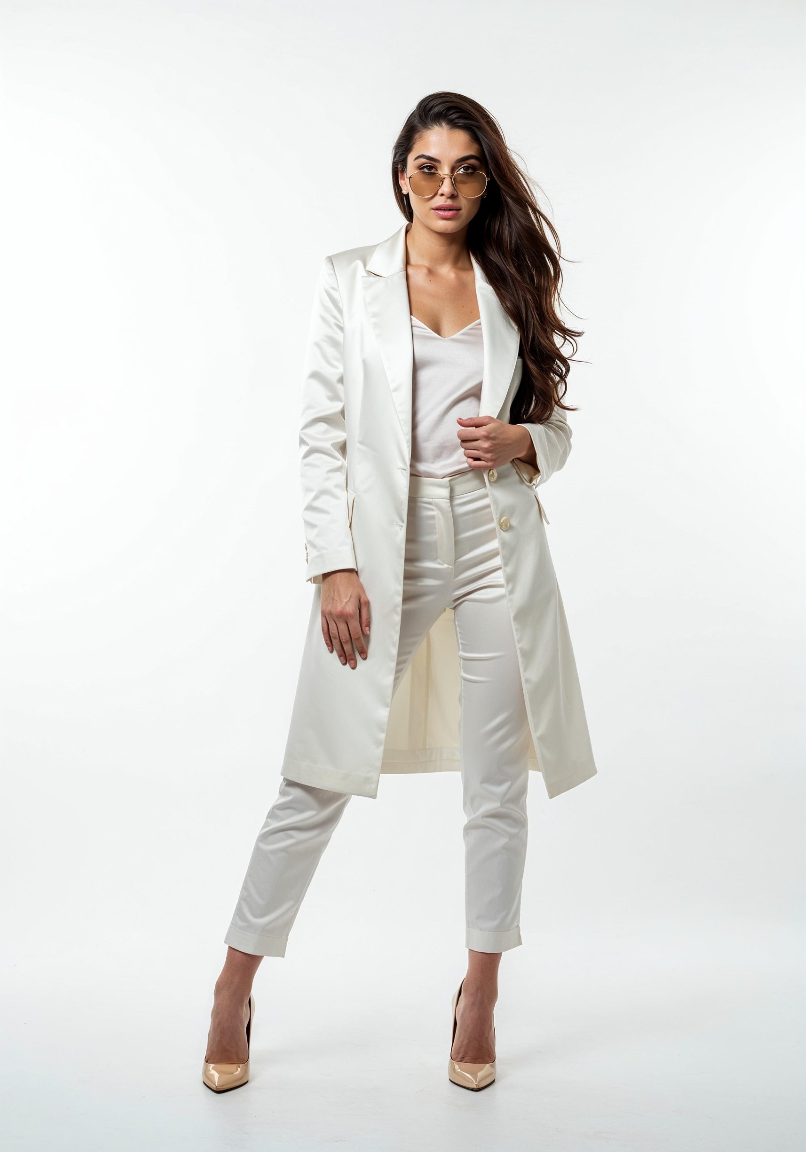 Elegant Young Woman in Coat and Matching Trousers Fashion Portrait
