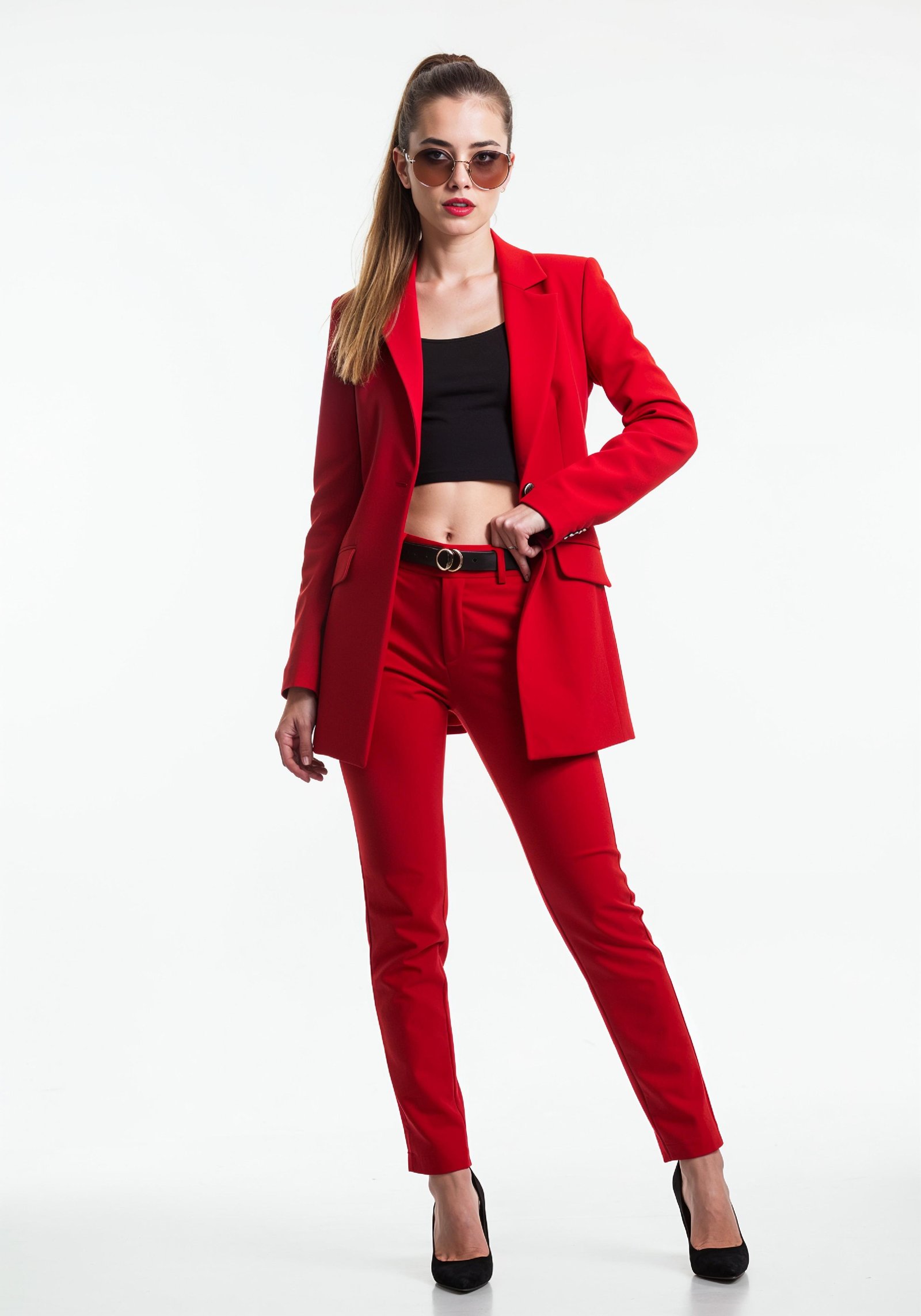 Elegant Young Woman in Coat and Matching Trousers Fashion Portrait