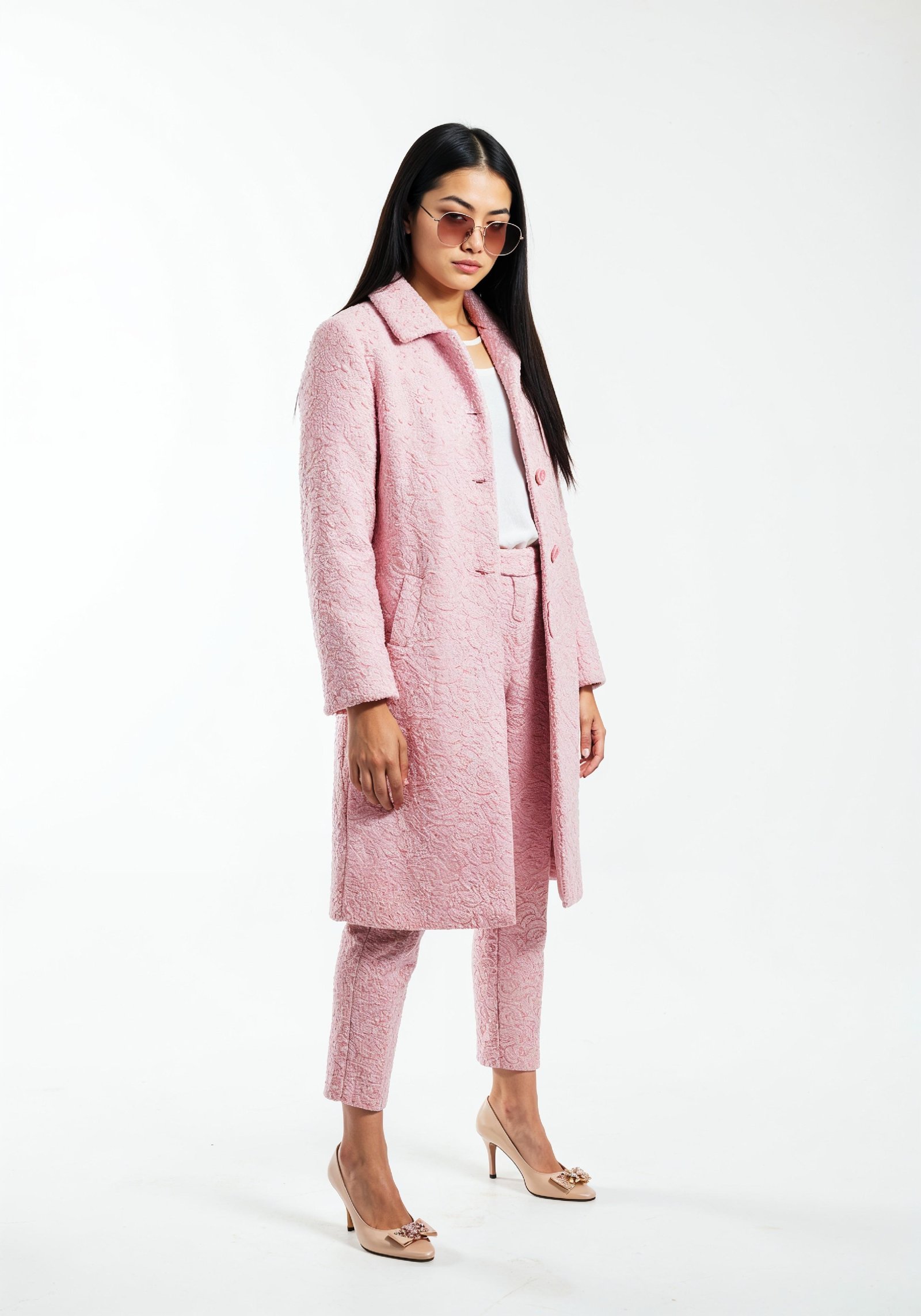 Elegant Young Woman in Coat and Matching Trousers Fashion Portrait