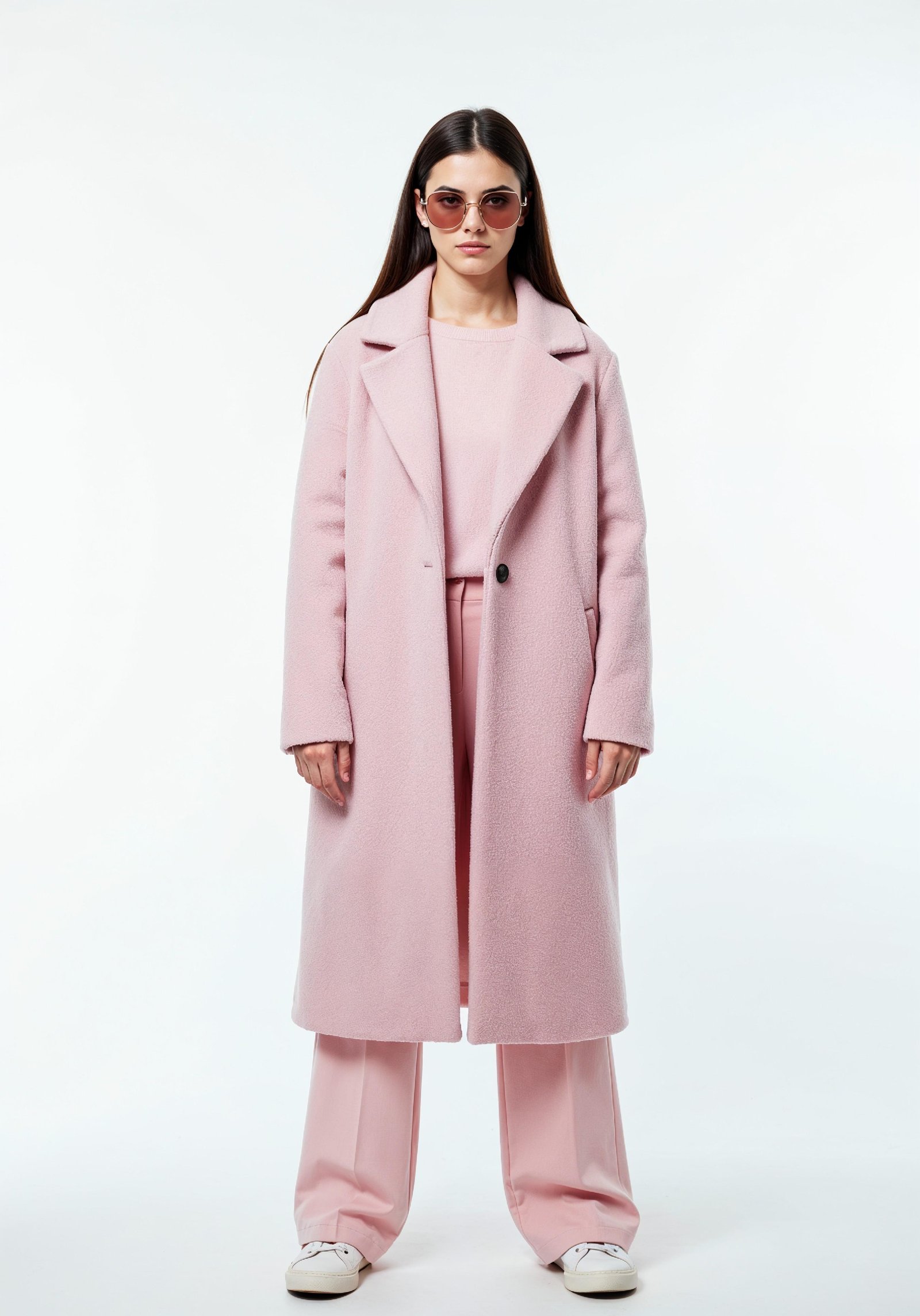 Elegant Young Woman in Coat and Matching Trousers Fashion Portrait