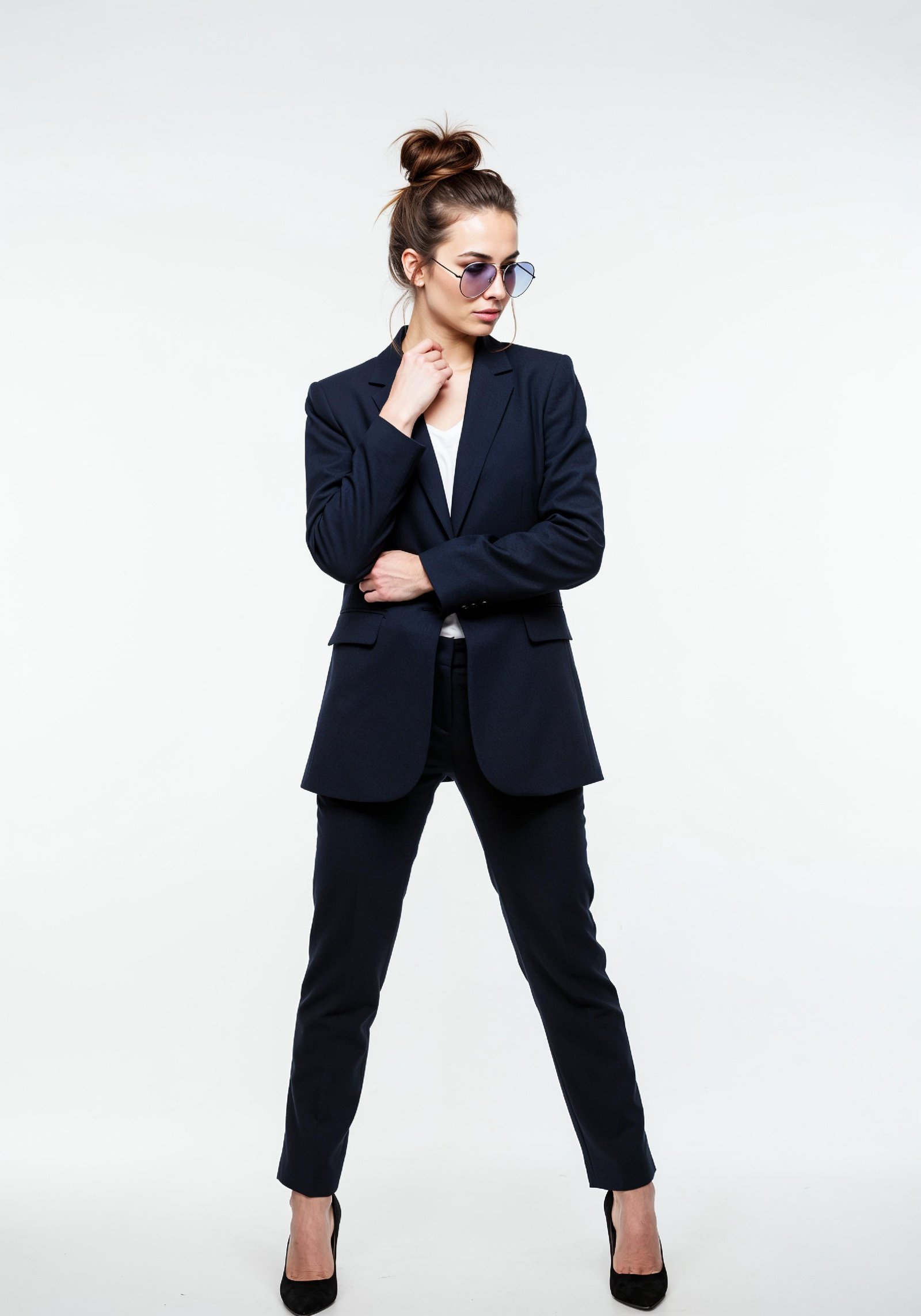 Elegant Young Woman in Coat and Matching Trousers Fashion Portrait