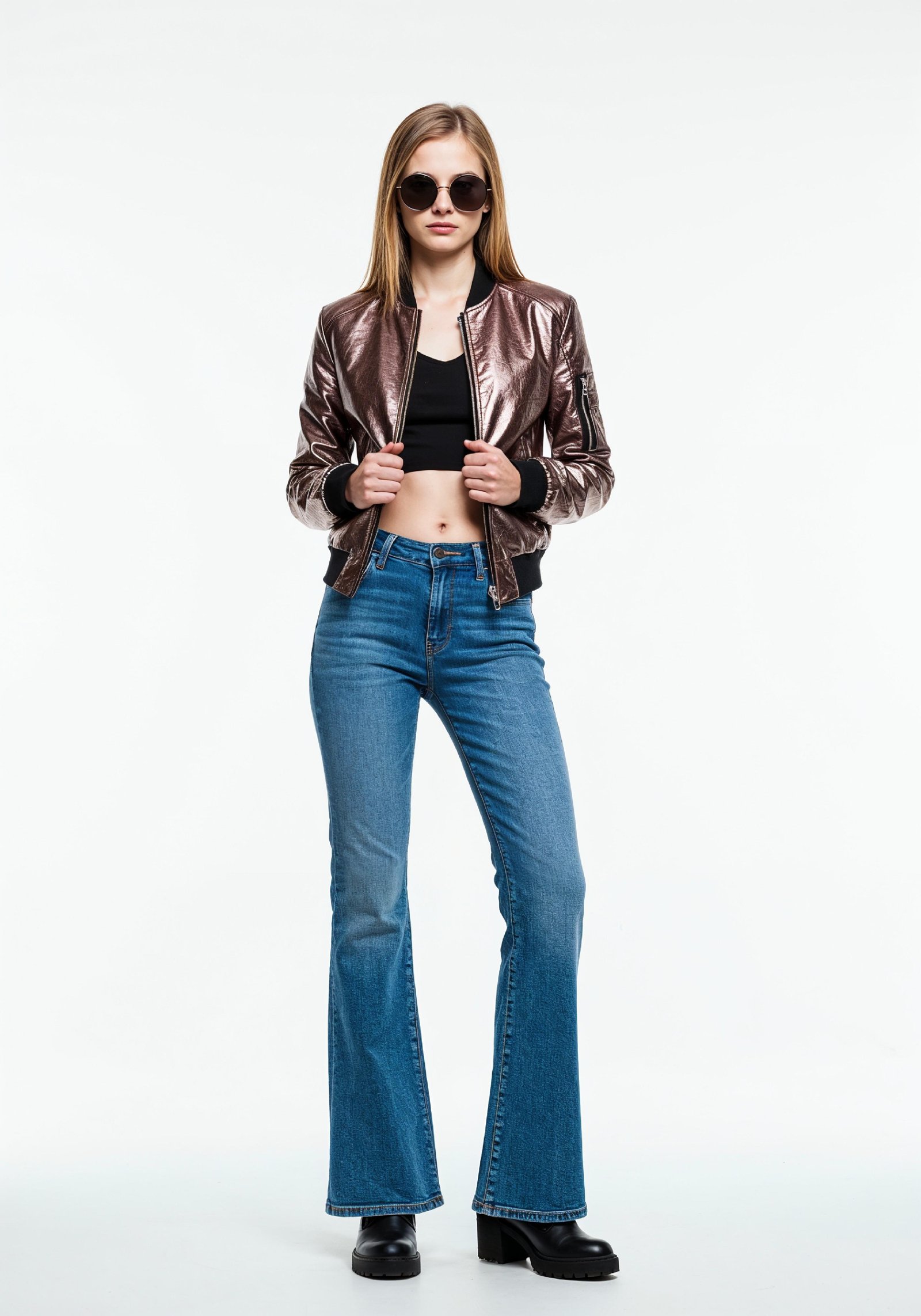 Fashionable Young Woman in Metallic Bomber Jacket and Flared Jeans Street Style Portrait