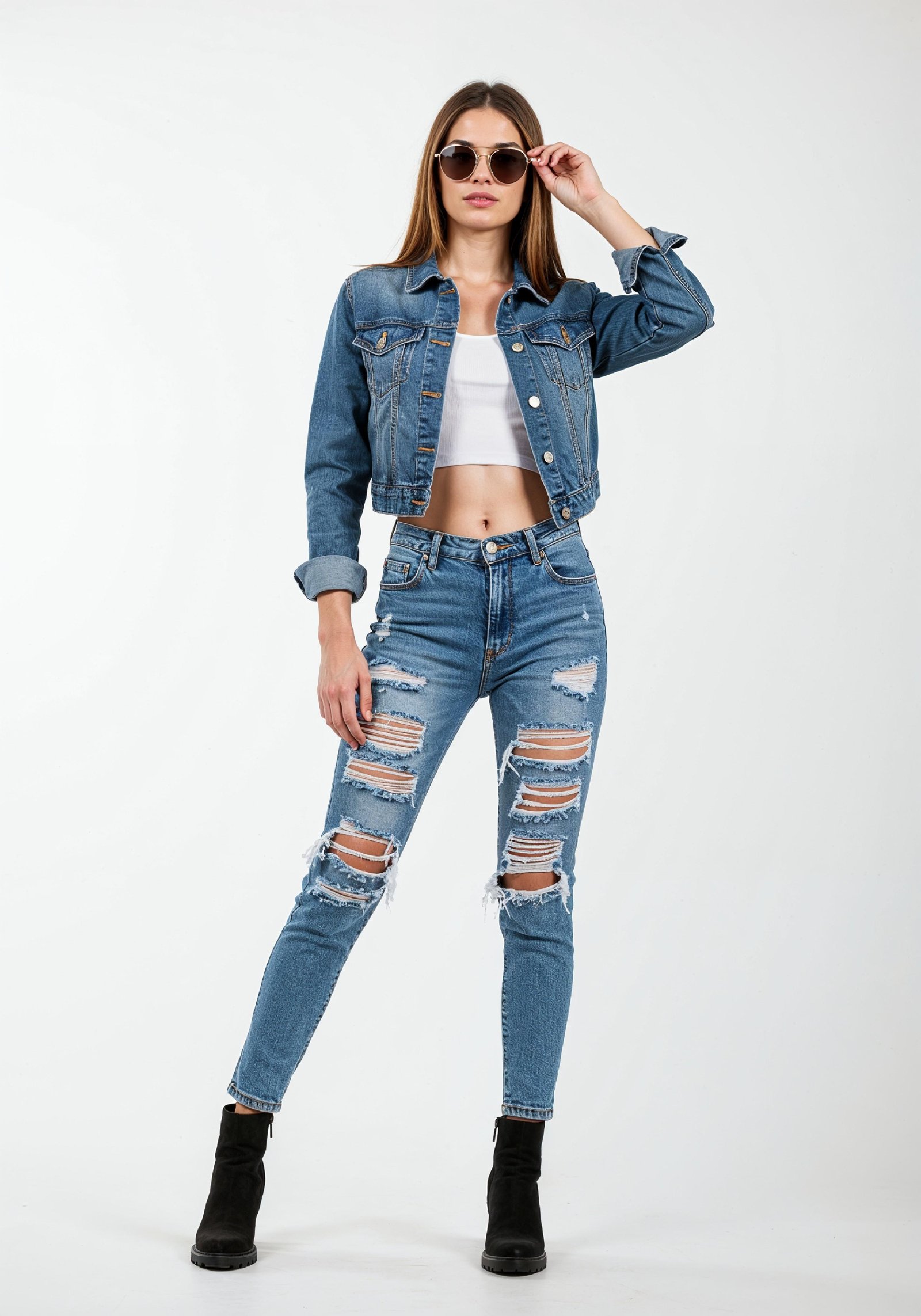 Fashionable Young Woman in Ripped Denim Jeans and Jacket Casual Street Style Portrait