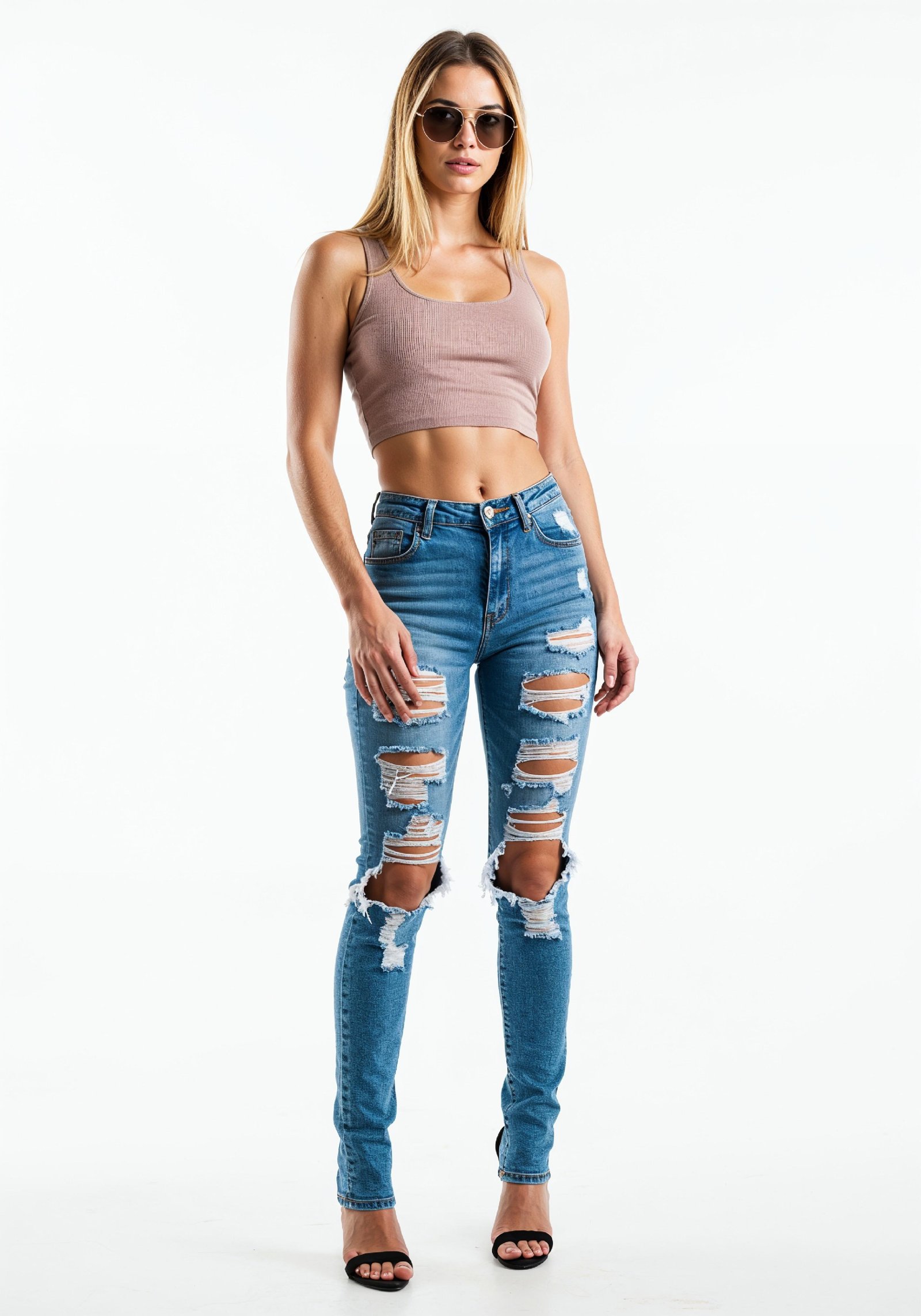 Fashionable Young Woman in Ripped Skinny Jeans and Crop Top Casual Street Style Portrait