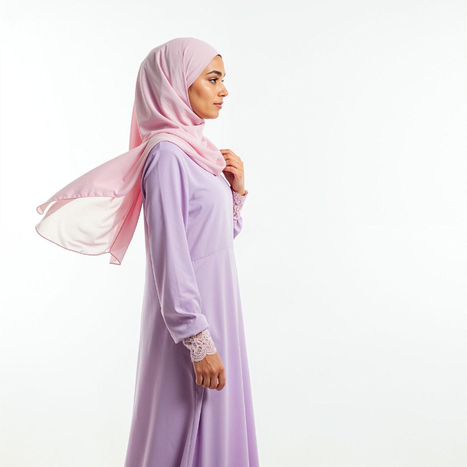 Graceful Young Muslim Woman Wearing Pastel Hijab and Elegant Modest Dress in Studio Portrait