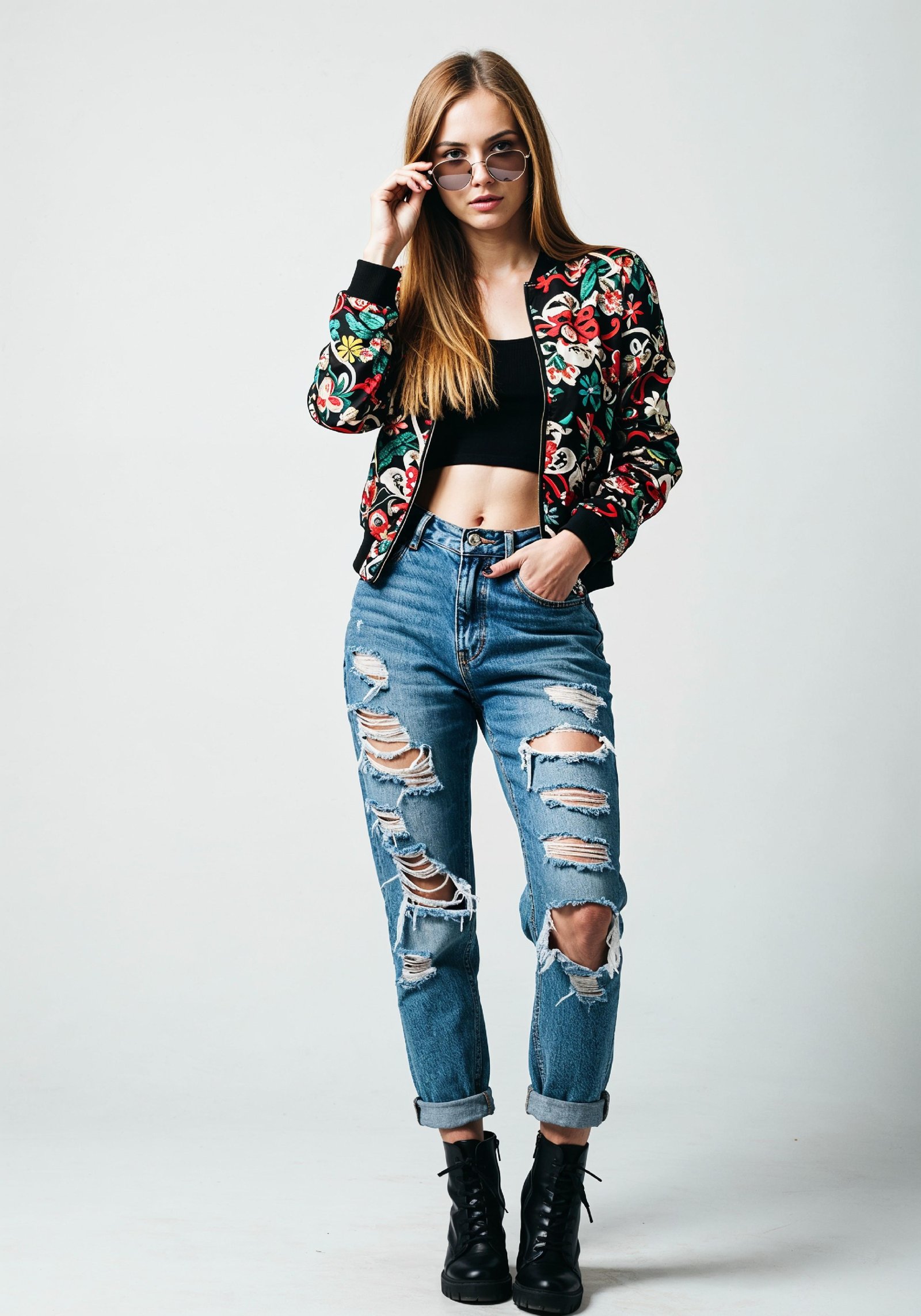 Stylish Young Woman in Floral Jacket and Ripped Jeans Trendy Street Fashion Portrait