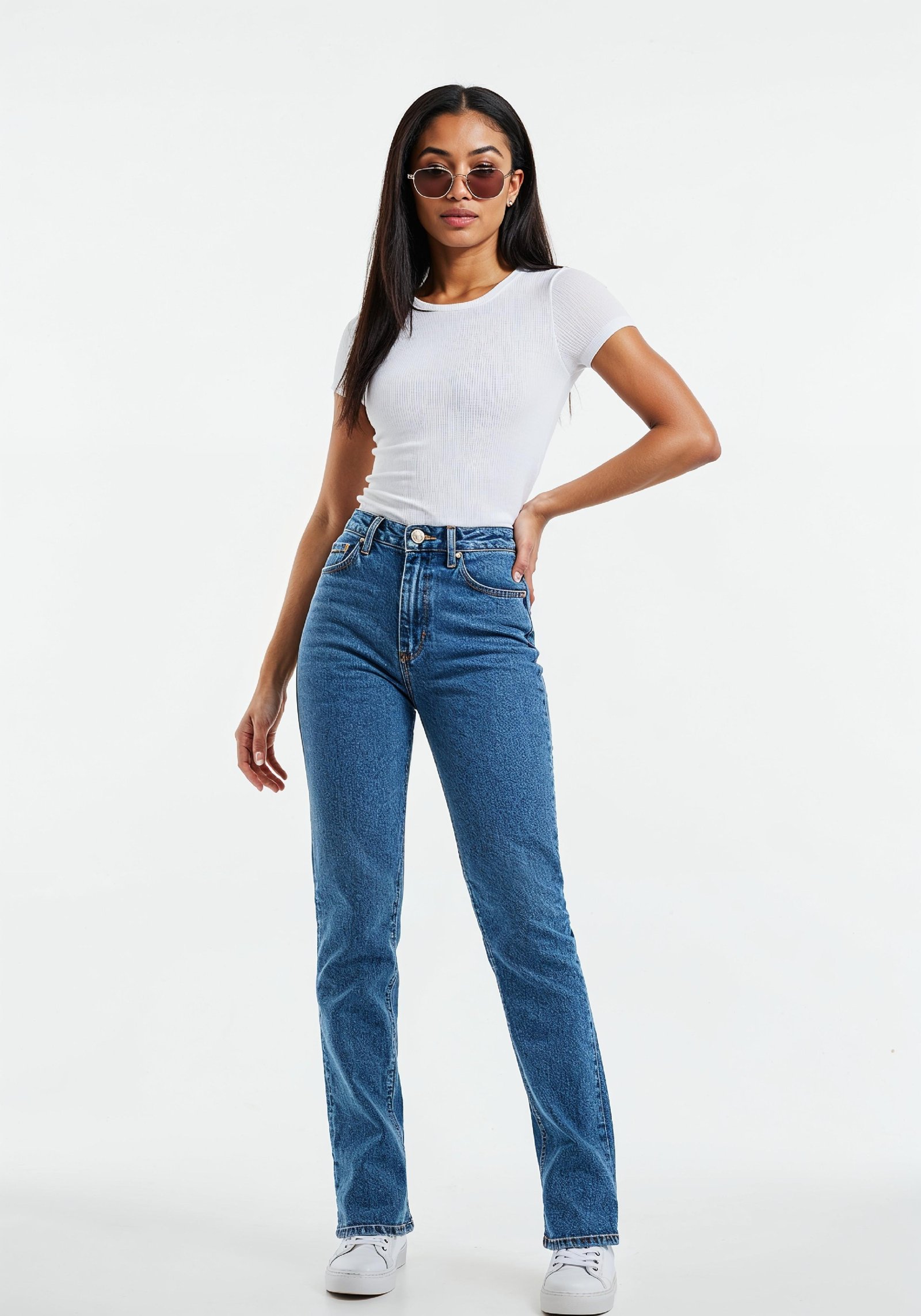 Stylish Young Woman in High Waist Jeans and White T Shirt Casual Fashion Portrait