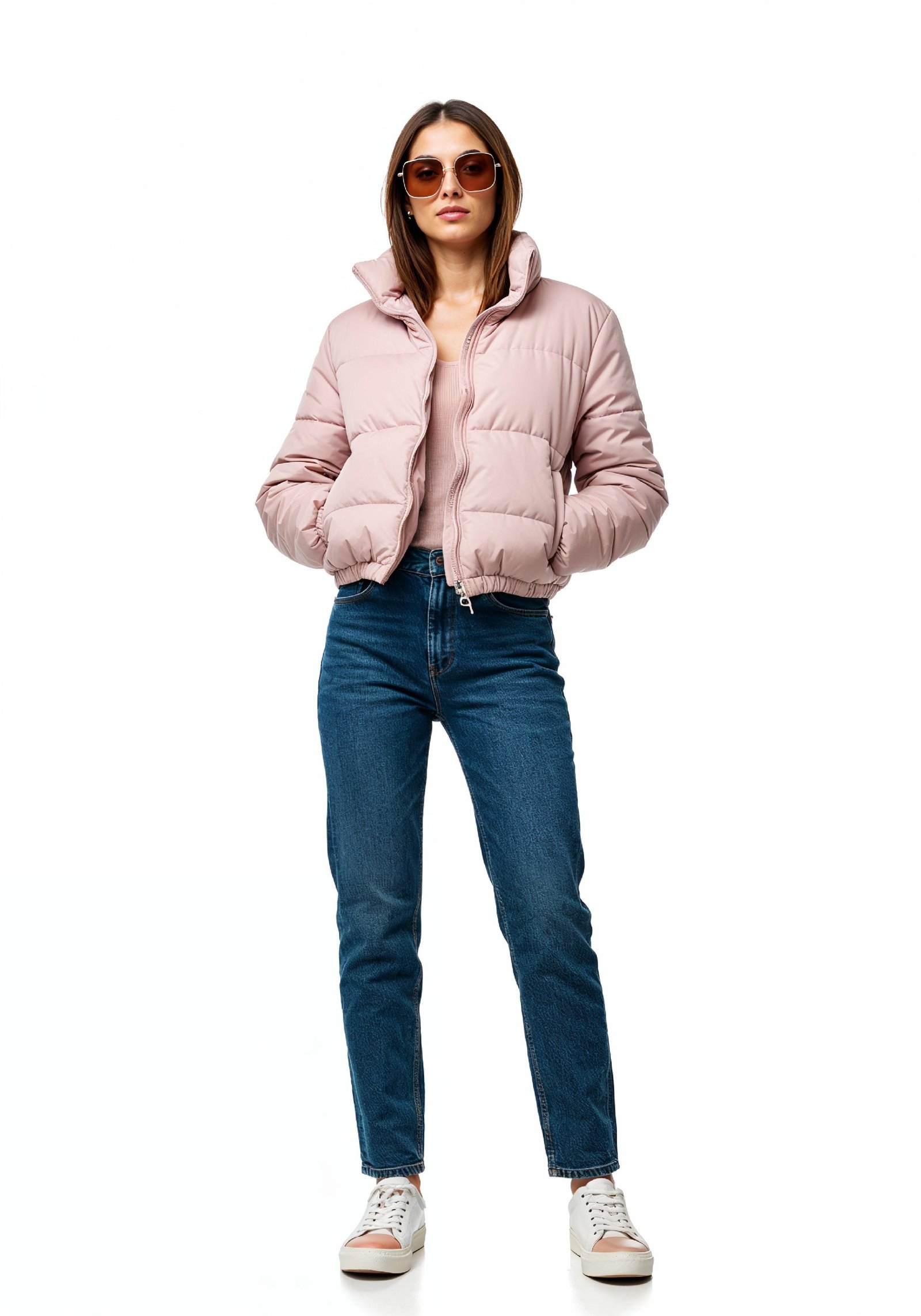 Stylish Young Woman in Pink Puffer Jacket and Blue Jeans Winter Fashion Portrait