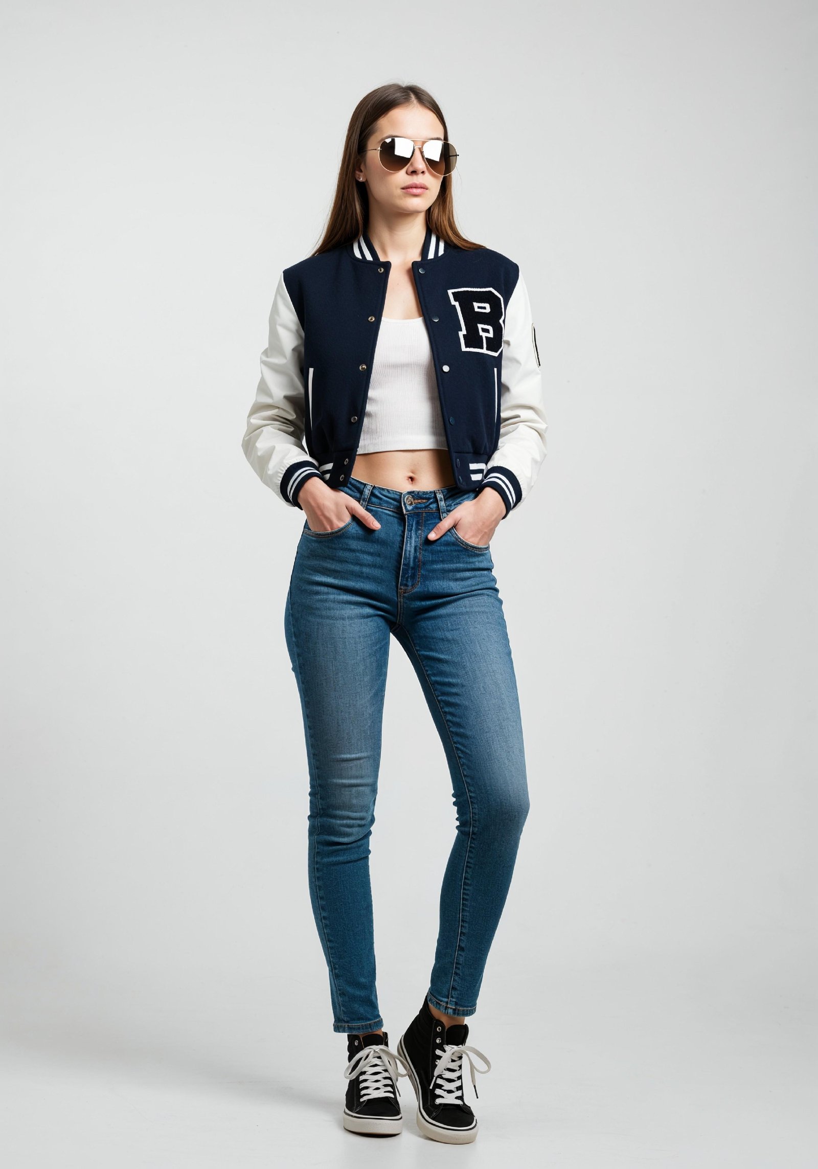 Stylish Young Woman in Varsity Jacket and Skinny Jeans Casual Fashion Portrait