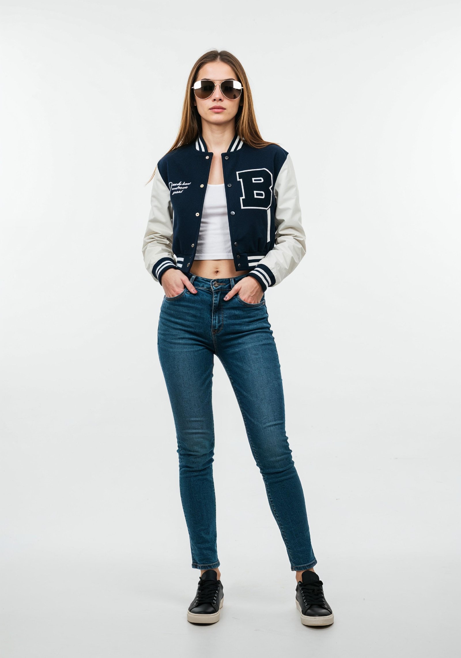 Stylish Young Woman in Varsity Jacket and Skinny Jeans Casual Fashion Portrait
