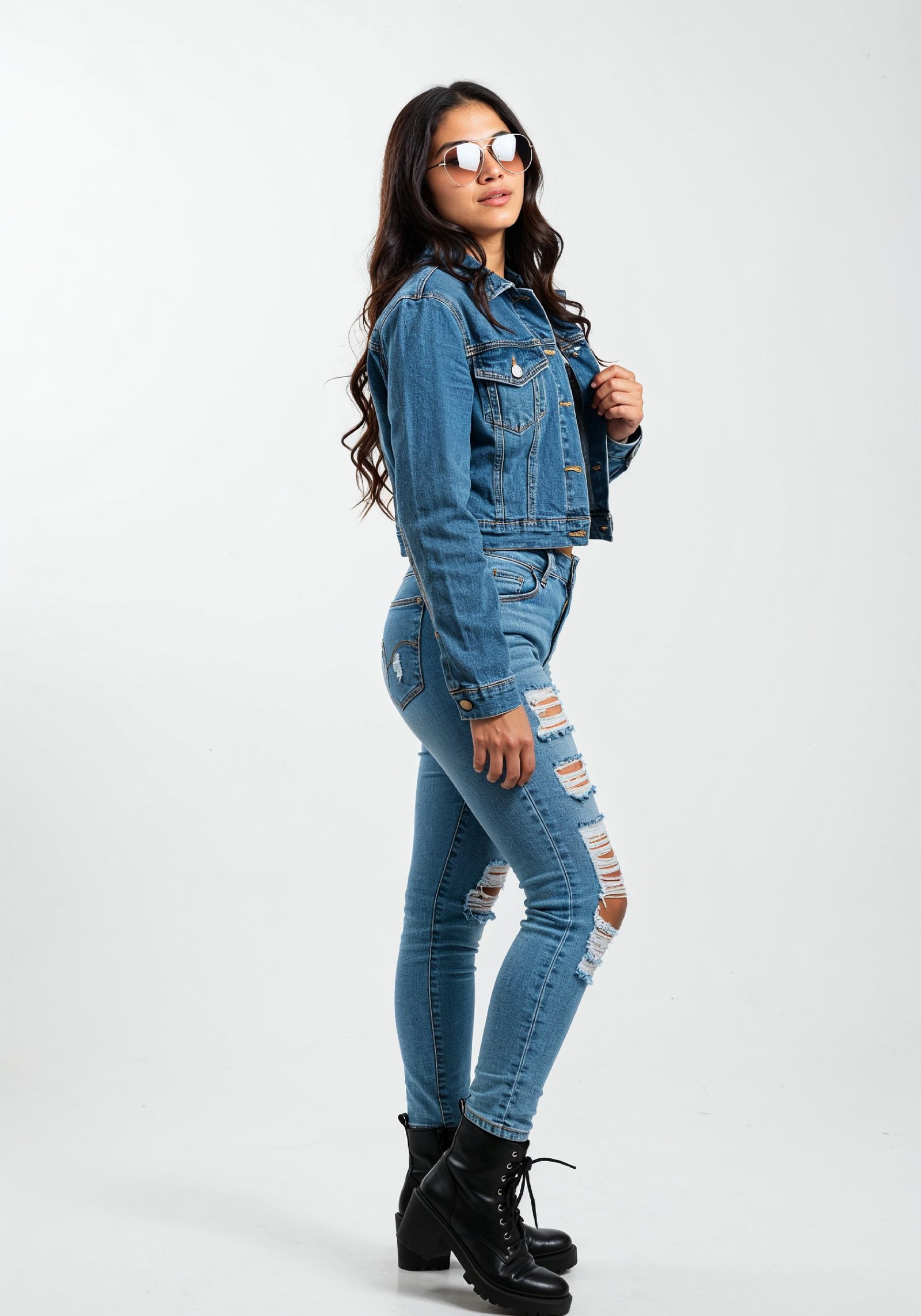 Trendy Young Woman in Ripped Jeans and Casual Jacket Modern Street Fashion Portrait