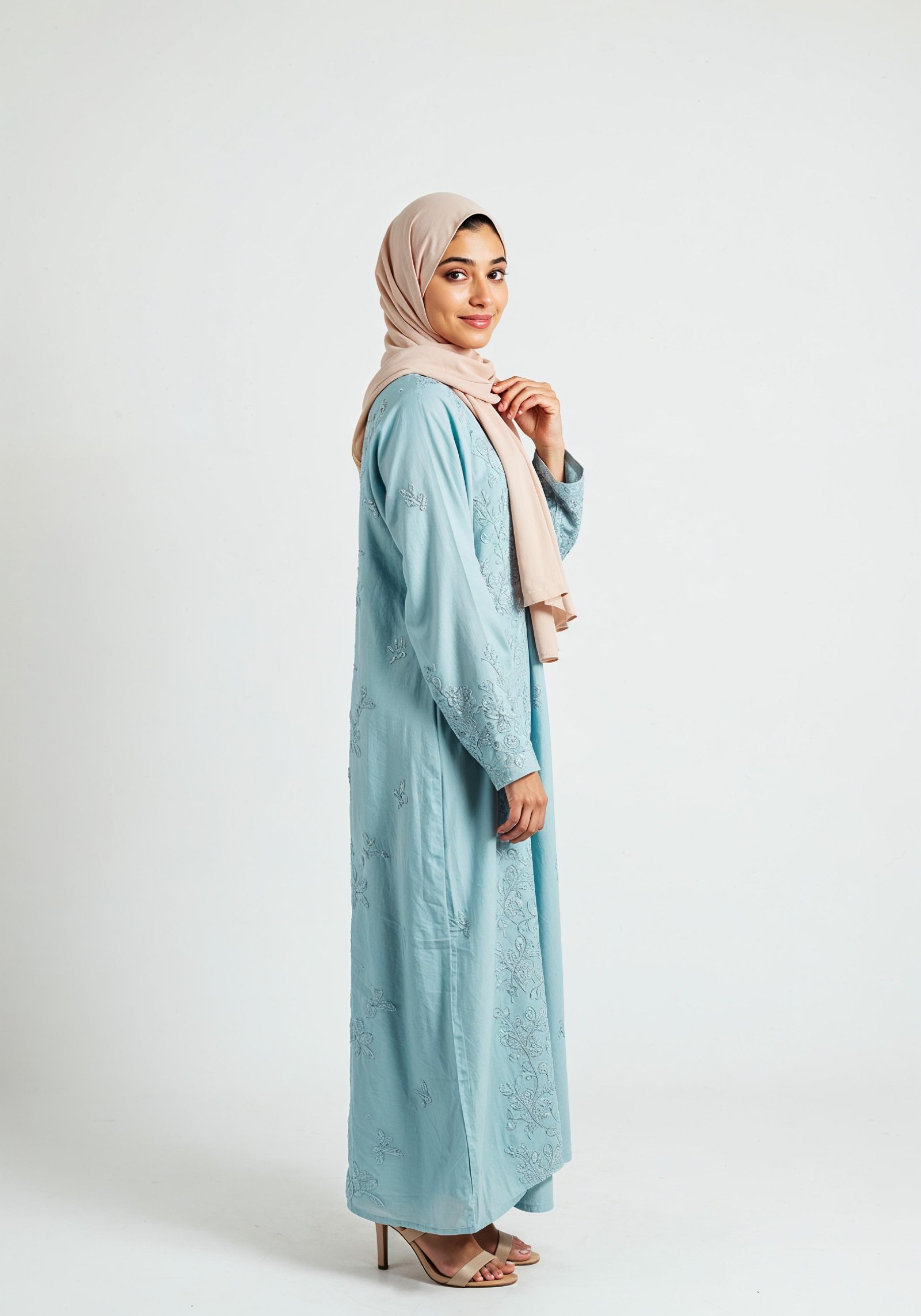 Young Muslim Woman in Modest Traditional Attire Educational Portrait