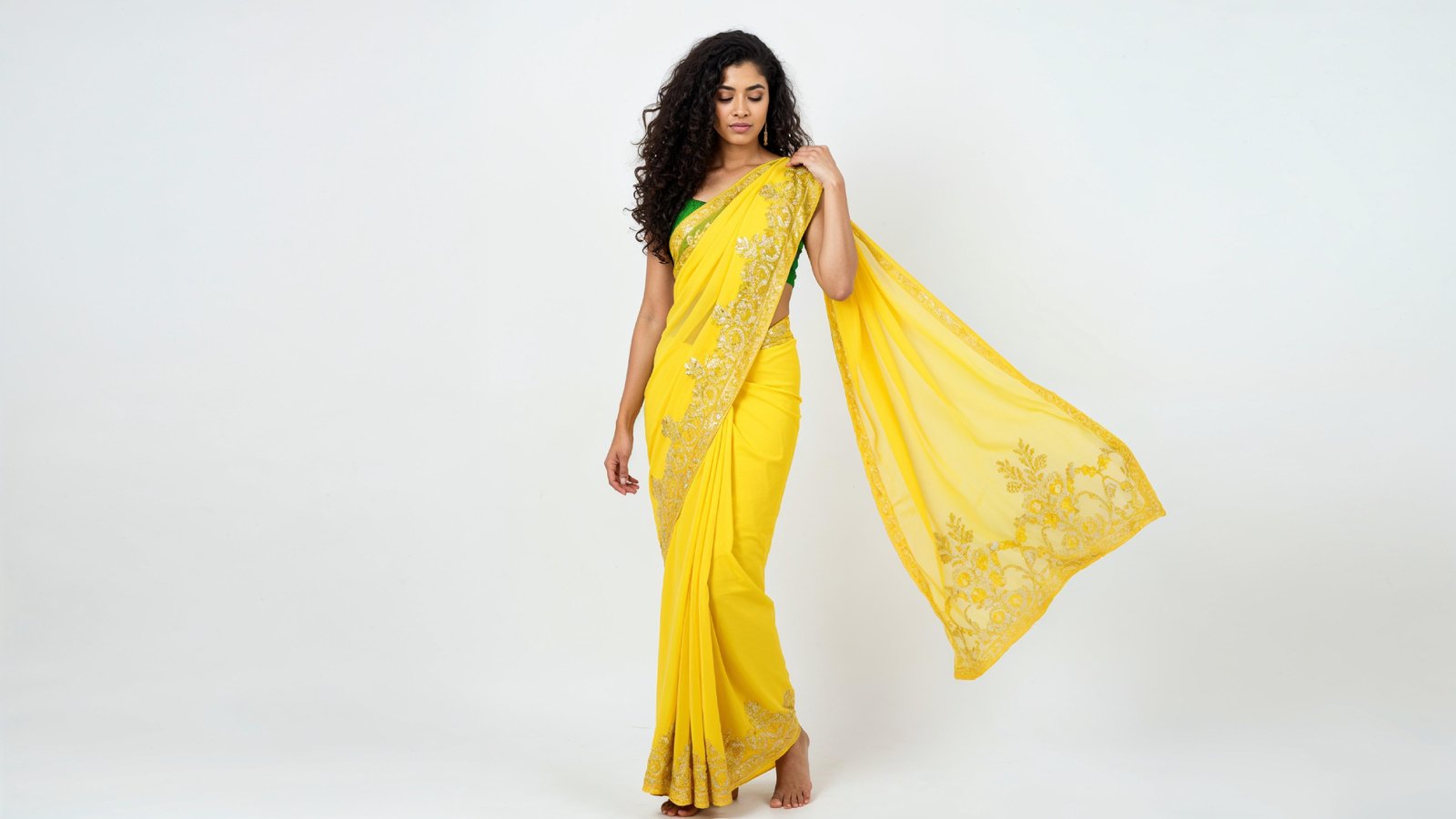 Beautiful Indian Woman Wearing Traditional Saree in Studio Portrait
