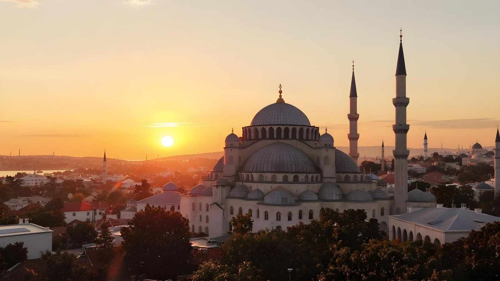 Beautiful Islamic Mosque at Sunset with Majestic Minarets and Golden Sky