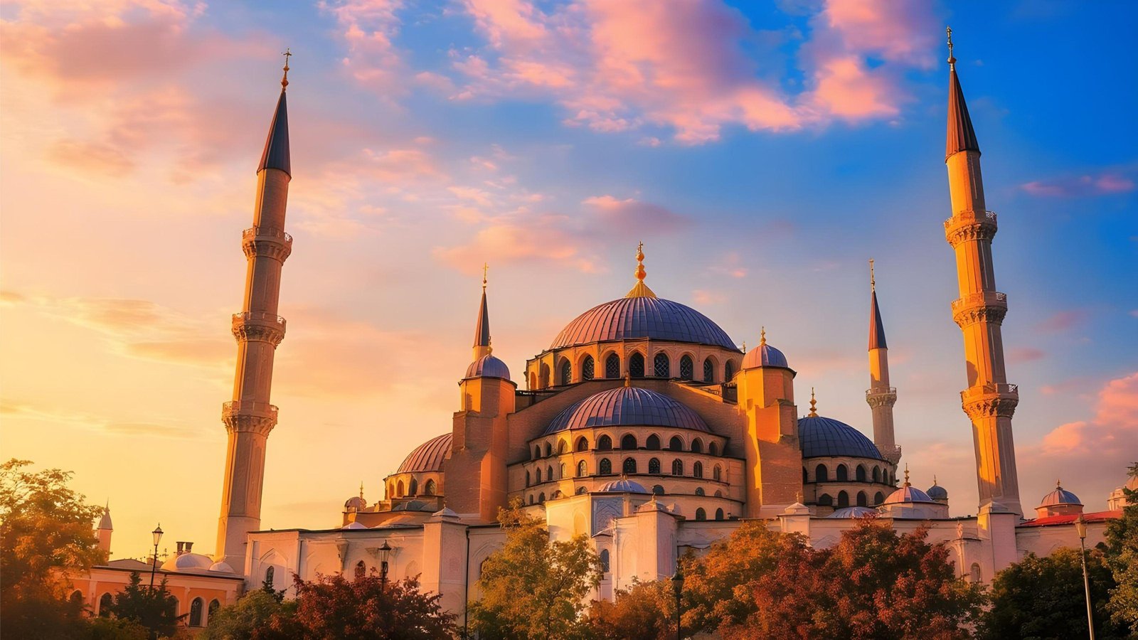 Beautiful Islamic Mosque at Sunset with Majestic Minarets and Golden Sky