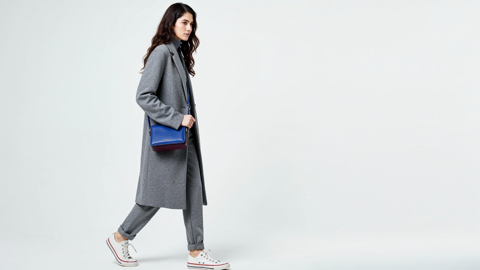 Fashionable Woman in Gray Coat and Trousers with Crossbody Bag