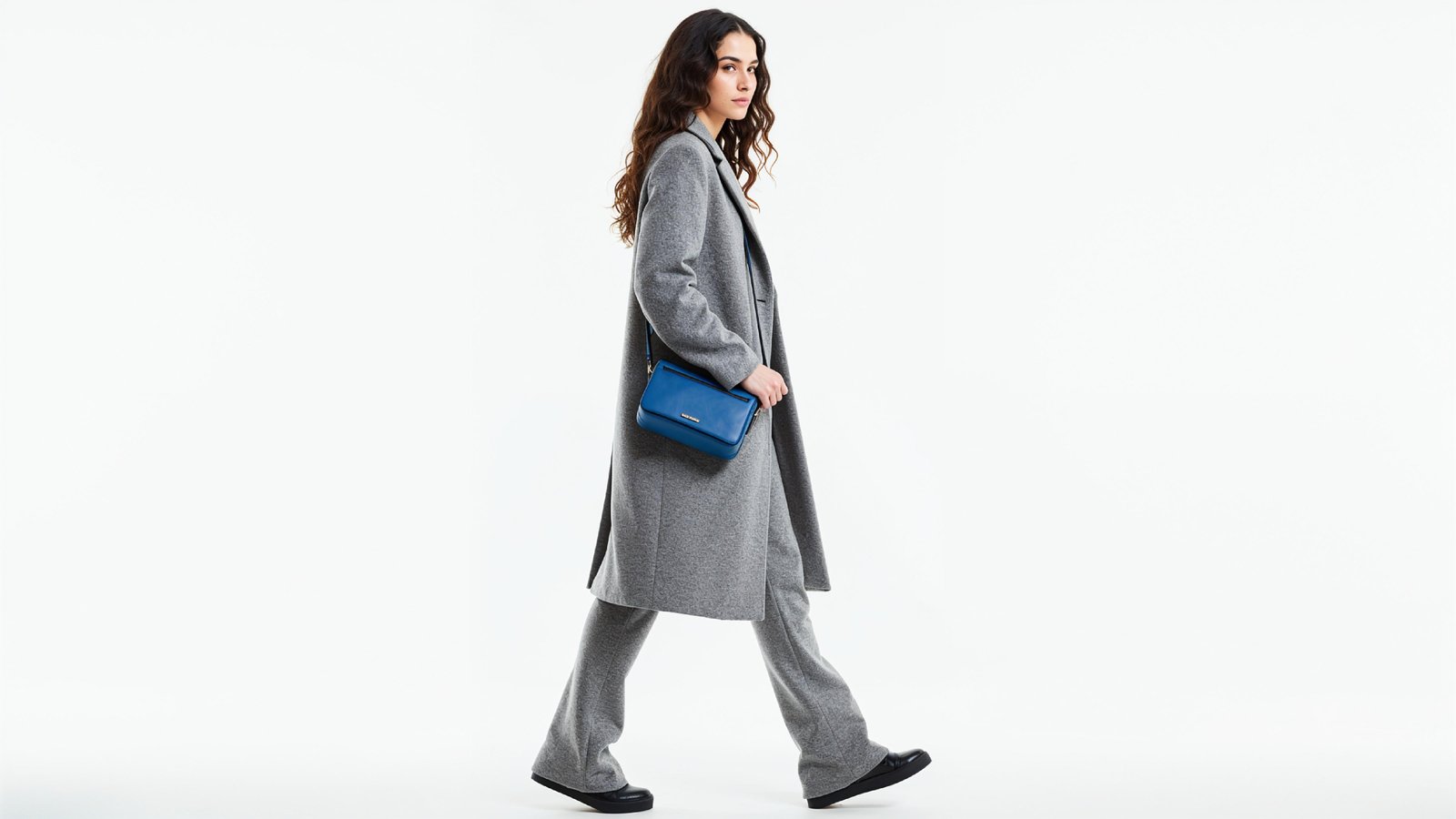 Fashionable Woman in Gray Coat and Trousers with Crossbody Bag