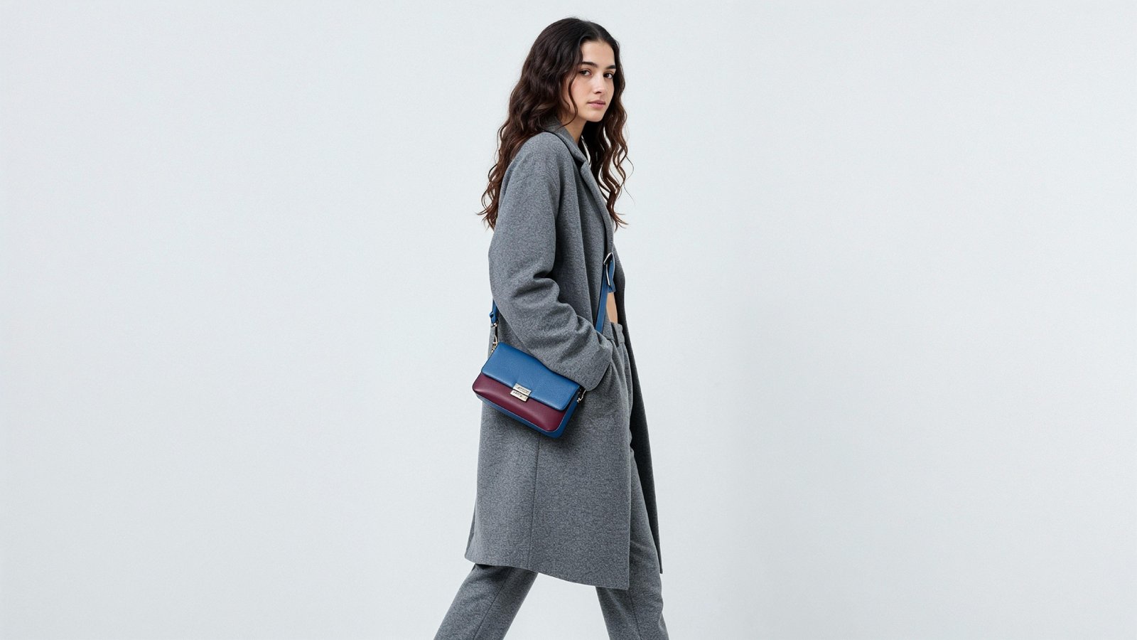 Fashionable Woman in Gray Coat and Trousers with Crossbody Bag
