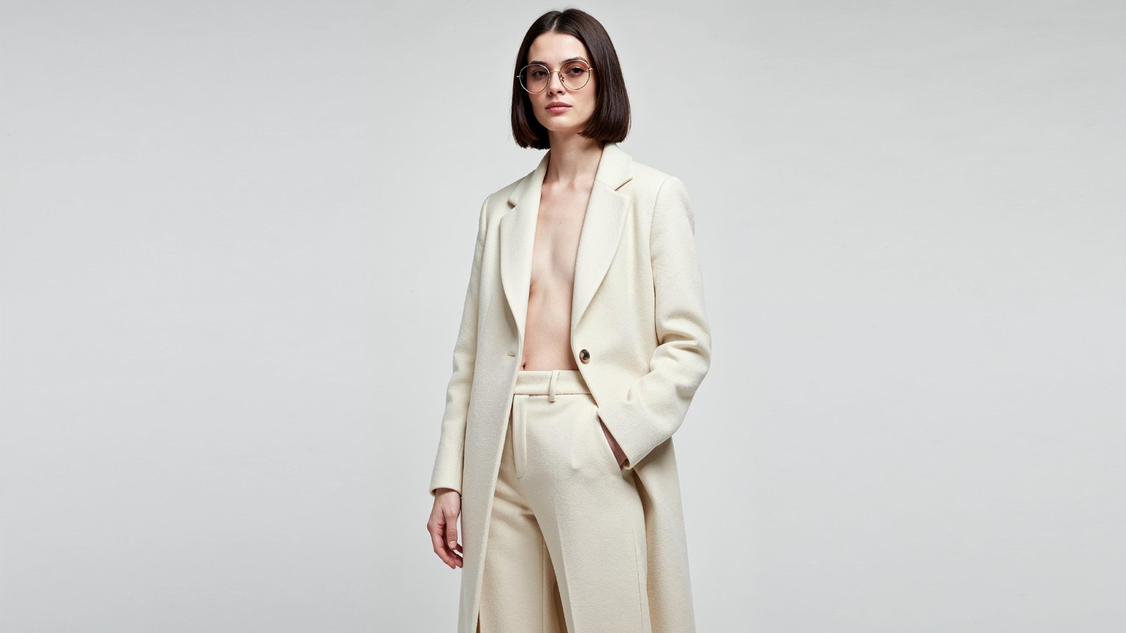 Stylish Young Woman Wearing Elegant Coat and Modern Fashion Outfit