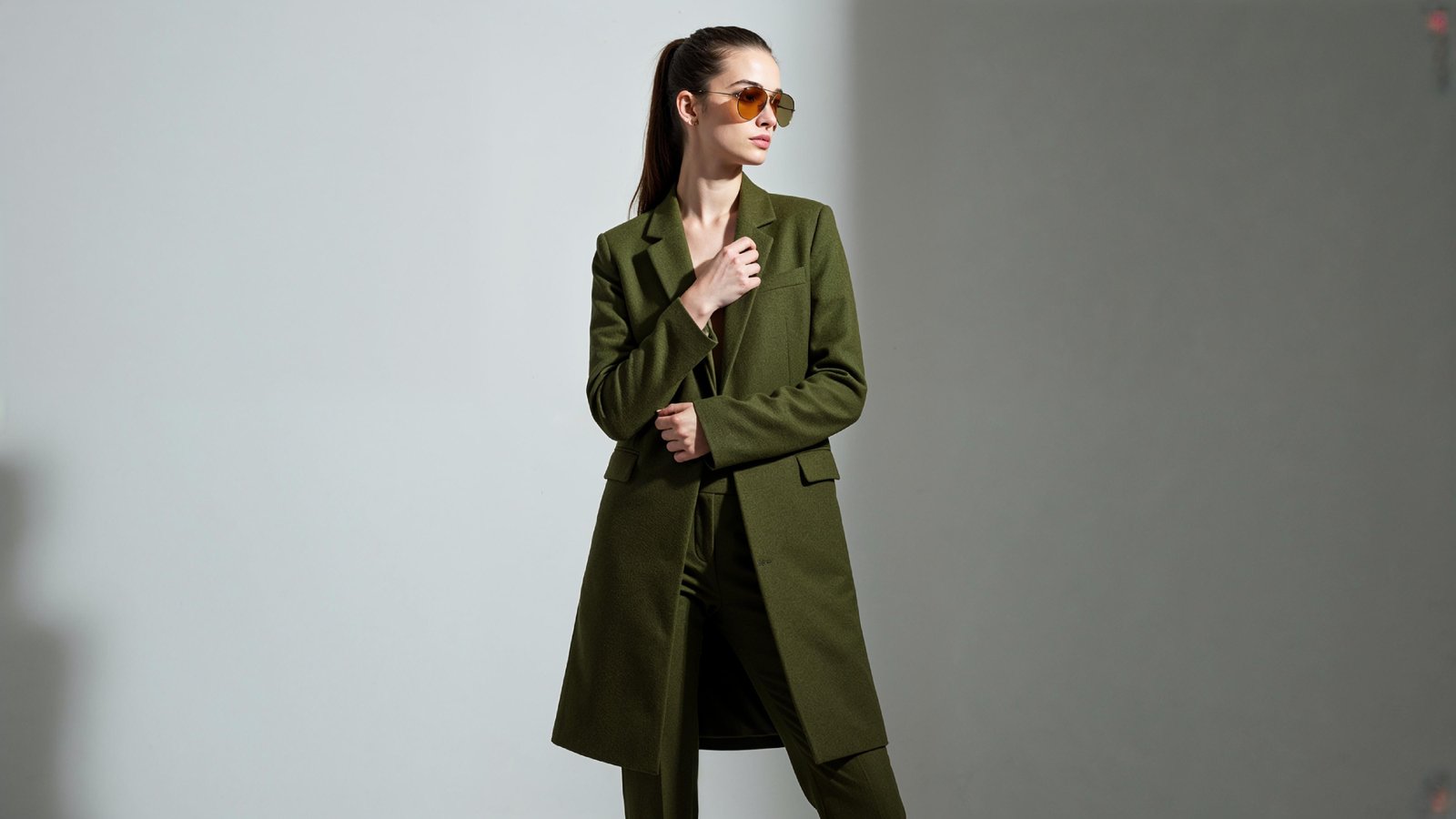 Stylish Young Woman Wearing Elegant Coat and Modern Fashion Outfit