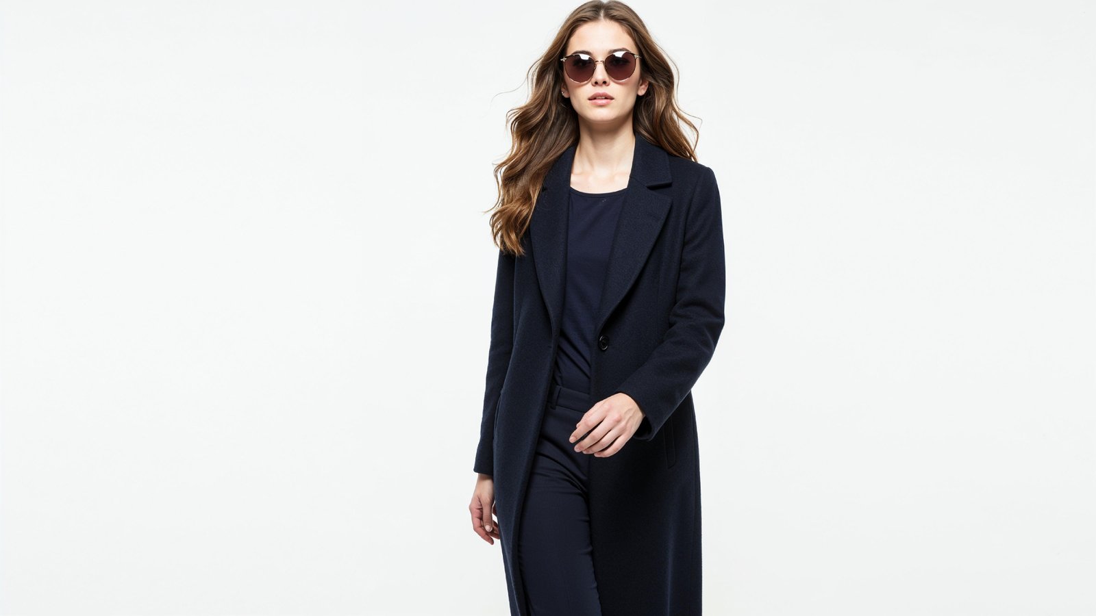 Stylish Young Woman Wearing Elegant Coat and Modern Fashion Outfit
