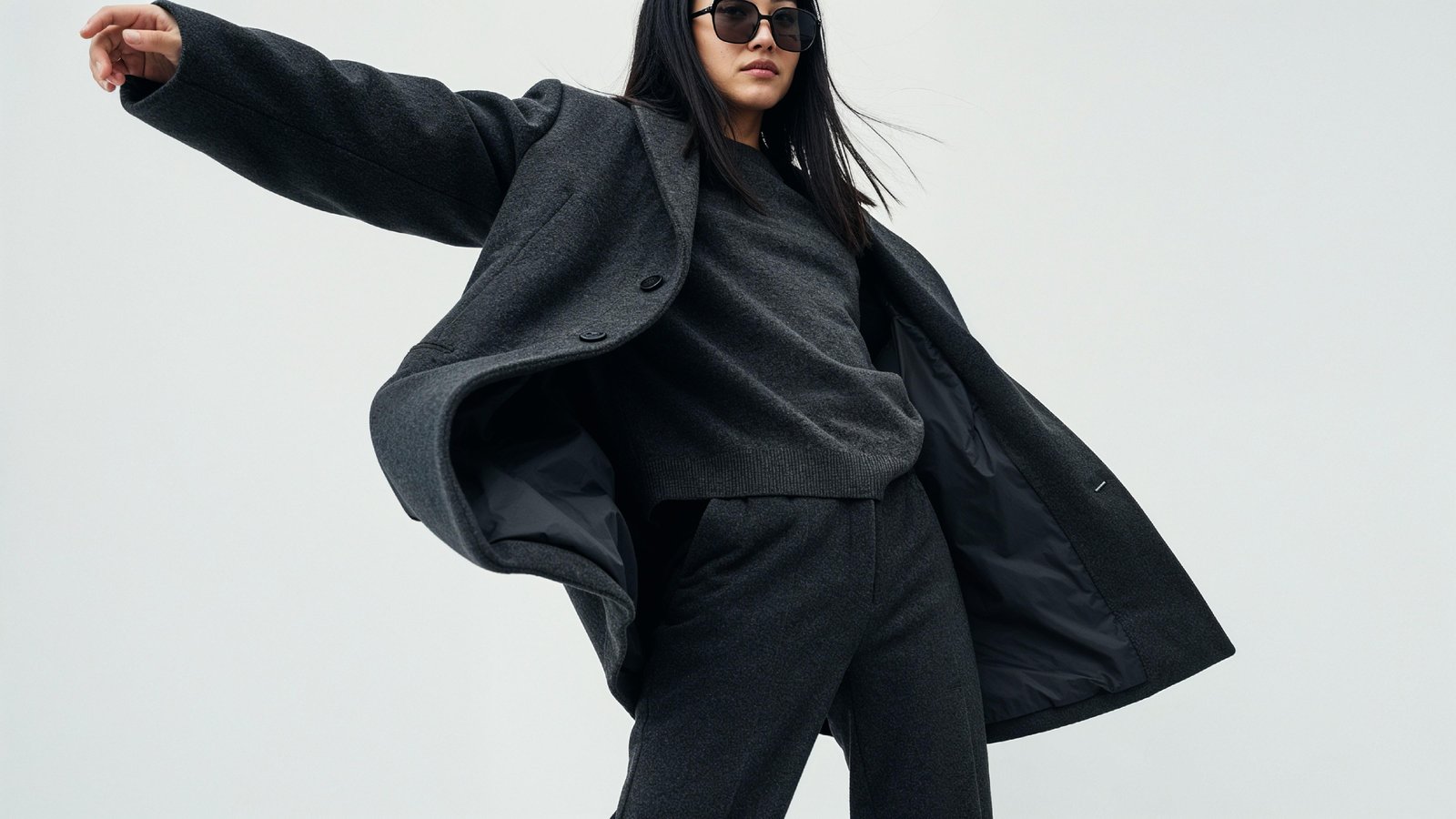 Stylish Young Woman Wearing Elegant Coat and Modern Fashion Outfit