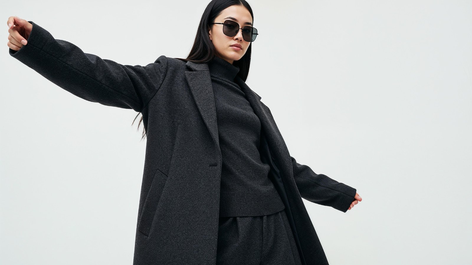 Stylish Young Woman Wearing Elegant Coat and Modern Fashion Outfit
