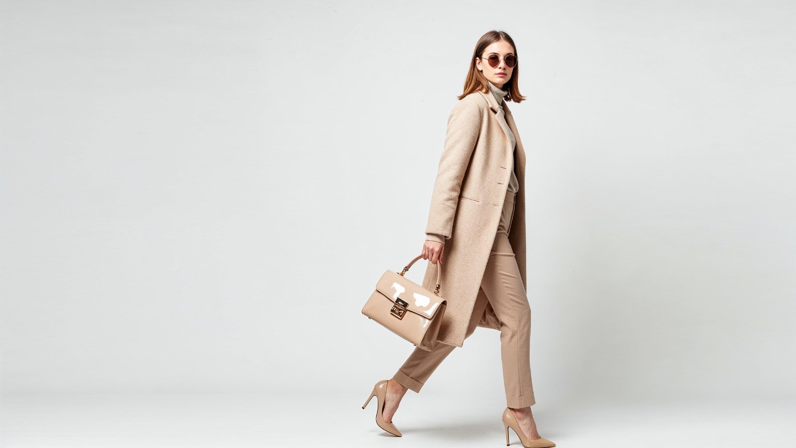 Stylish Young Woman Wearing Elegant Coat and Modern Fashion Outfit